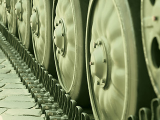 Image showing Tracked military equipment close-up, toned in green