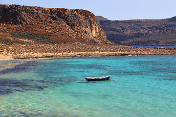 Image showing Sea view with clear turquoise water and empty boat, Crete island