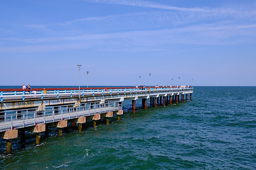 Image showing Boardwalk pier in Baltic Sea udnder cloudy sky