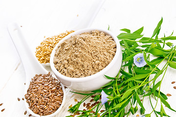 Image showing Flour linen in bowl with seeds on board