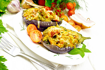 Image showing Eggplant stuffed smoked brisket and vegetables in plate on board