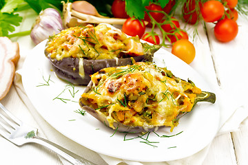 Image showing Eggplant stuffed smoked brisket in plate on wooden table