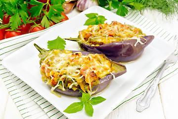 Image showing Eggplant stuffed brisket and vegetables in plate on board