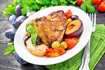 Image showing Chicken with fruits and tomatoes in plate on table