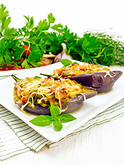 Image showing Eggplant stuffed brisket and vegetables in plate on white board