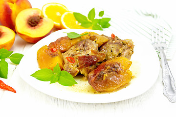 Image showing Turkey with peaches in plate on light board