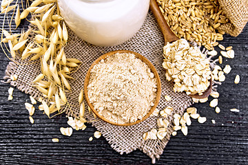 Image showing Flour oat in bowl on dark board top