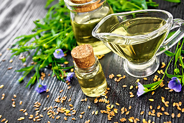 Image showing Oil flaxseed with flowers on board