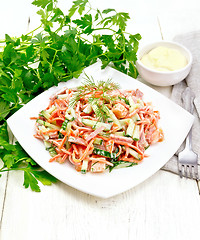 Image showing Salad of sausage and spicy carrots with mayonnaise on wooden tab