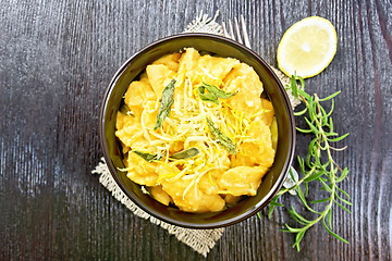 Image showing Gnocchi pumpkin in bowl on dark board top