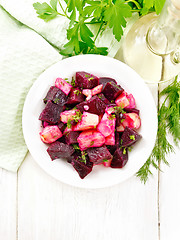 Image showing Salad of beets and potatoes in plate on board top