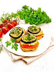 Image showing Appetizer of aubergines and cheese on light board