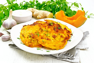 Image showing Pancakes of pumpkin in plate on white board