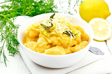 Image showing Gnocchi pumpkin with lemon in bowl on white board