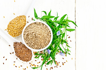 Image showing Flour linen in bowl with seeds on board top