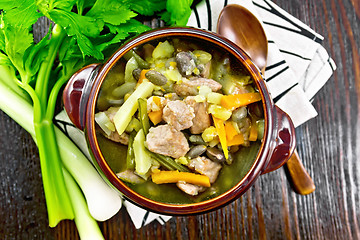 Image showing Soup Eintopf in clay bowl on board top