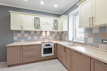 Image showing Luxury modern provence styled grey, pink and cream kitchen interior