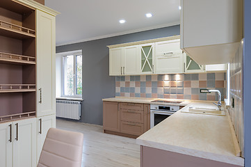 Image showing Luxury modern provence styled grey, pink and cream kitchen interior