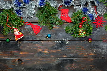 Image showing Festive Christmas composition with tinsel and fir branches.