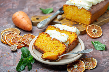 Image showing Slices of homemade carrot cake on a ceramic plate.