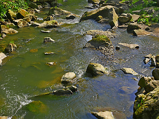 Image showing Mountain river with fast stream and big boulders