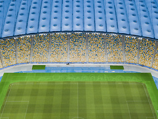 Image showing Aerial view from the drone to the football stadium with the blue-yellow stands