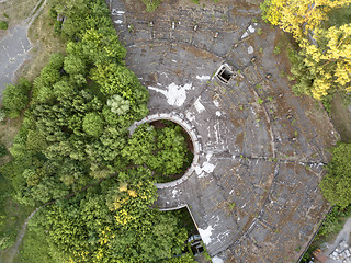 Image showing Top view of the old destroyed roof and green trees on a summer day. Aerial view from the drone