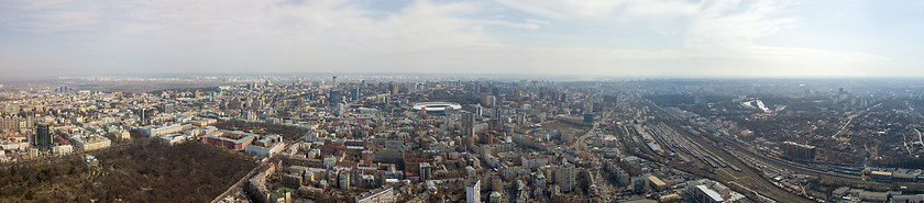 Image showing Panoramic aerial view from drone. on the city of Kiev with a railway and a stadium in the distance against the sky.