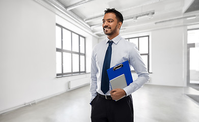 Image showing indian businessman or realtor in empty office room