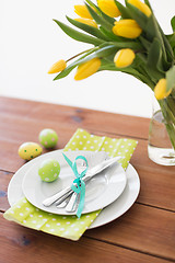 Image showing easter egg, plates, cutlery and tulip flowers