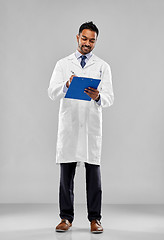 Image showing smiling indian doctor or scientist with clipboard