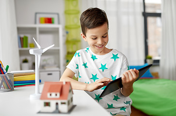 Image showing boy with tablet, toy house and wind turbine