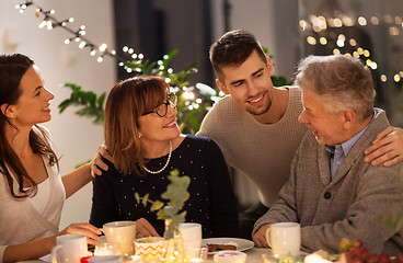 Image showing happy family having tea party at home