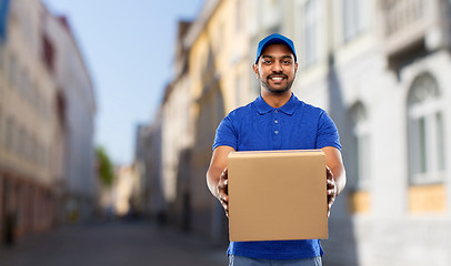 Image showing happy indian delivery man with parcel box in city