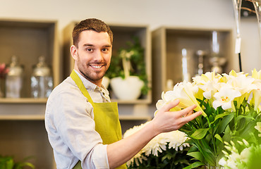 Image showing florist or seller with white lilies at flower shop