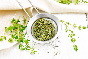 Image showing Thyme fresh and dry in strainer on table