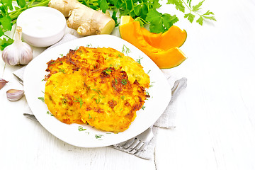 Image showing Pancakes of pumpkin in plate on light board