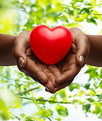 Image showing female hands with small red heart