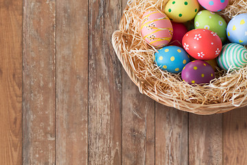 Image showing close up of colored easter eggs in basket