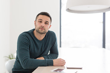 Image showing Young casual businessman using smartphone