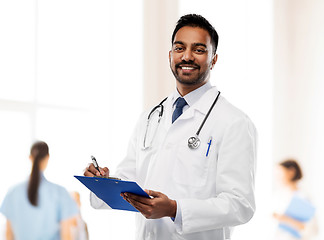 Image showing indian male doctor with clipboard and stethoscope