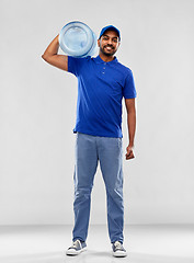 Image showing happy indian delivery man with water barrel