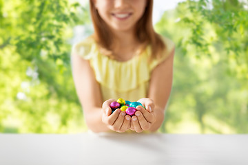 Image showing close up of girl holding chocolate easter eggs