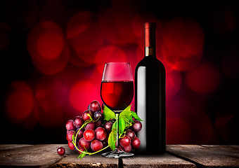 Image showing Red wine and grapes