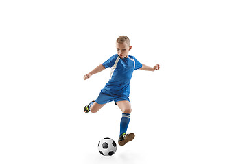 Image showing Young boy with soccer ball doing flying kick