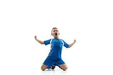 Image showing Young boy with soccer ball doing flying kick