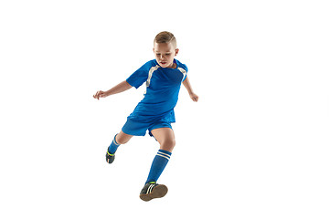 Image showing Young boy with soccer ball doing flying kick