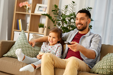 Image showing happy father and daughter watching tv at home