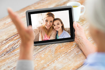 Image showing family having video call on tablet computer