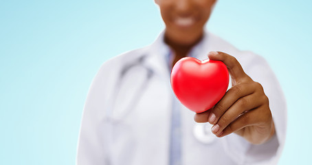 Image showing african american doctor hand holding red heart